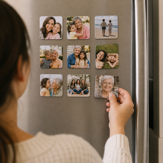 Custom photo magnets on refrigerator – close-up of person placing a 2x2 photo magnet of mom/grandmother on a fridge, surrounded by a grid of personalized family photo magnets, meaningful Mother’s Day gift idea